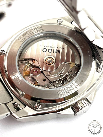 Mido Multifort TV Big Date — Fondello trasparente aperto con Caliber 80 automatico rotore dorato MIDO Swiss Watches Since 1918